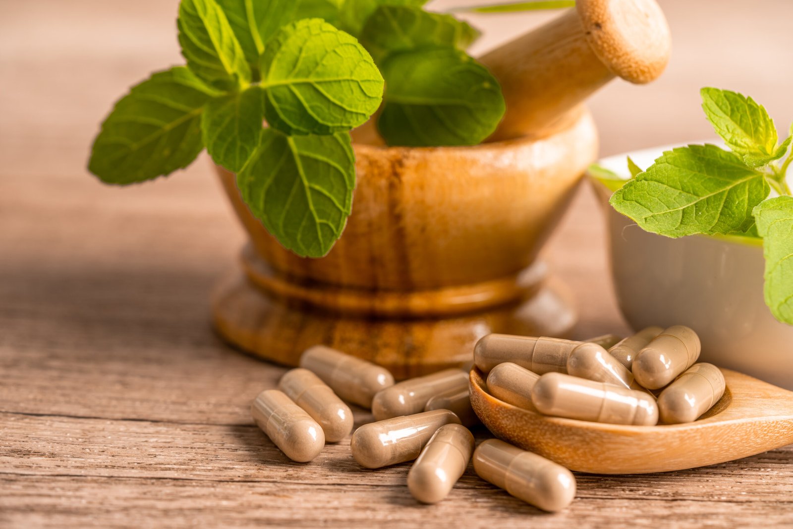 Pot with herbs surrounded with capsules